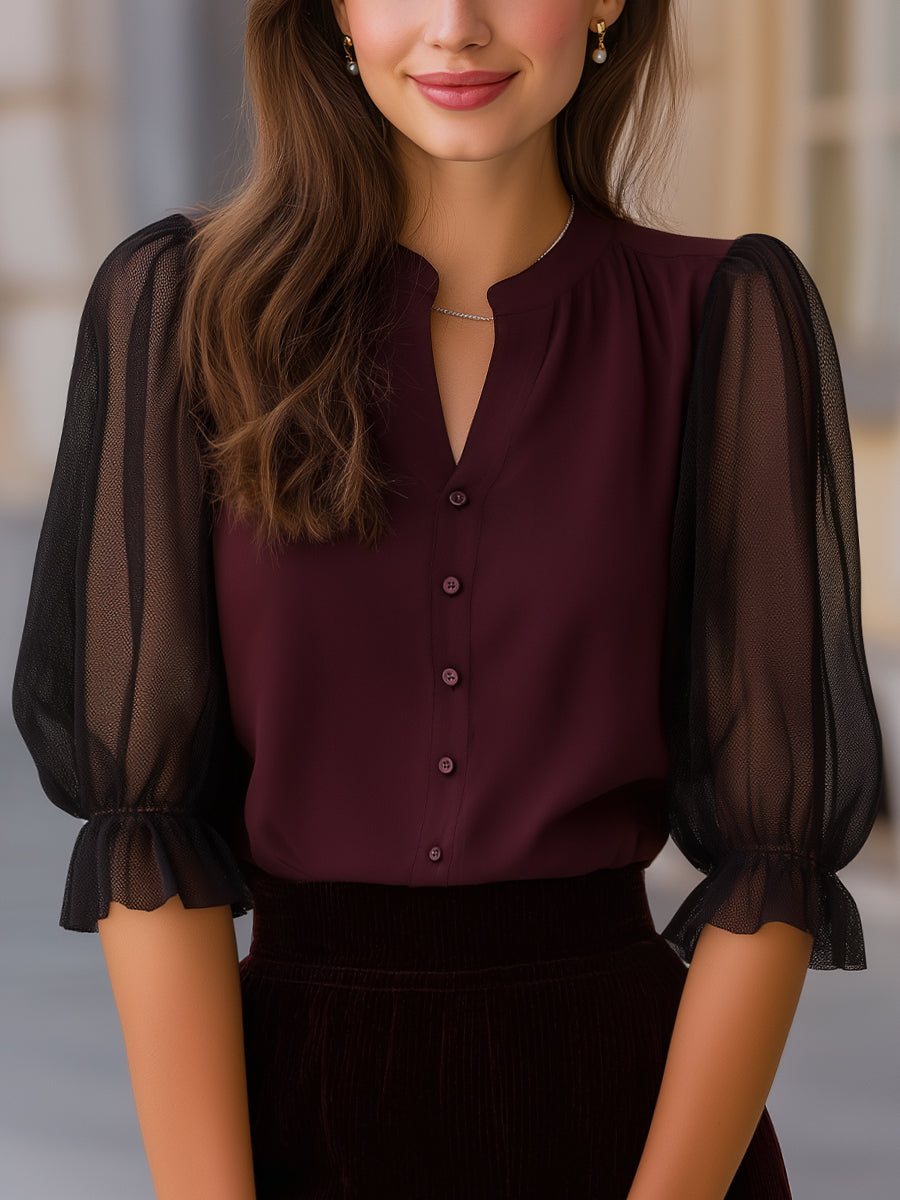 Blouse transparente à manches bouffantes avec fermeture boutonnée
